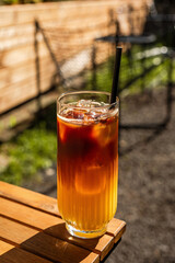 Bumble cold coffee drink, espresso and orange juice, on the terrace of a cafe