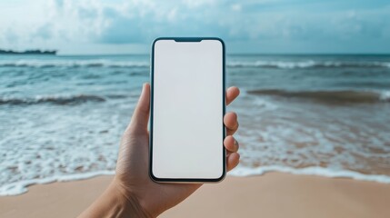 Stay Connected Anywhere: Hand Holding Smartphone with Blank Screen on Beautiful Beach Background
