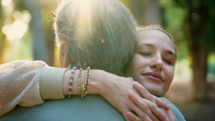 Young daughter hugging her father