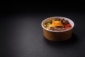 Bowl of food with beef, bulgur, tomatoes, mushrooms, zucchini