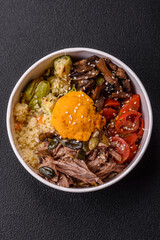 Bowl of food with beef, bulgur, tomatoes, mushrooms, zucchini