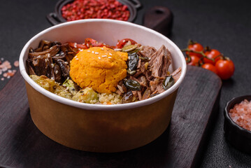 Bowl of food with beef, bulgur, tomatoes, mushrooms, zucchini