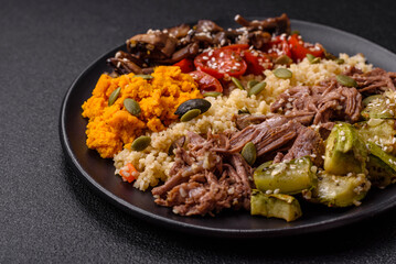 Bowl of food with beef, bulgur, tomatoes, mushrooms, zucchini