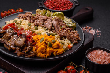 Bowl of food with beef, bulgur, tomatoes, mushrooms, zucchini