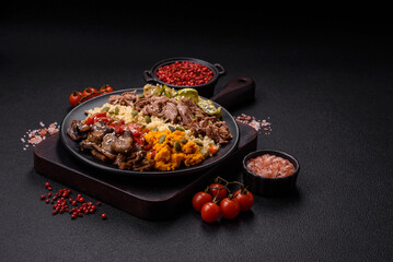 Bowl of food with beef, bulgur, tomatoes, mushrooms, zucchini