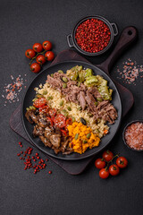 Bowl of food with beef, bulgur, tomatoes, mushrooms, zucchini