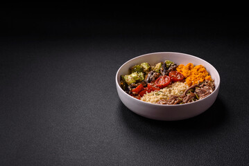 Bowl of food with beef, bulgur, tomatoes, mushrooms, zucchini
