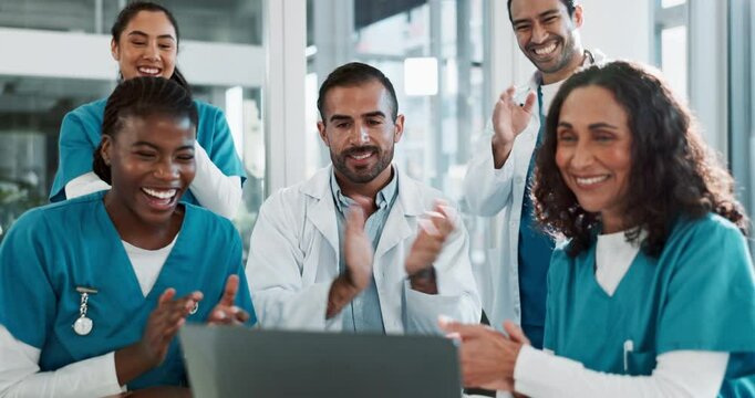 Happy people, doctors and laptop with applause for good news, winning or achievement together at hospital. Excited group, medical employees or team with high five or clapping for healthcare success