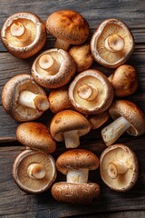 Fresh brown mushrooms on wooden surface ready for cooking or garnishing dishes