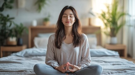 Woman meditating peacefully in a bright room filled with plants