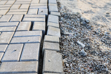 Damaged paving tiles. Defect in public space requiring repair.