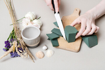 Florist at work: How to make simple floral arrangement with eustoma and limonium. Step by step,...