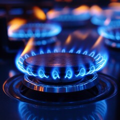 Close-Up of Gas Stove Burner with Vibrant Blue Flame