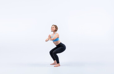 Obraz premium Full body length gaiety shot athletic and sporty woman doing healthy and meditative yoga exercise workout posture on isolated background. Healthy active and body care lifestyle
