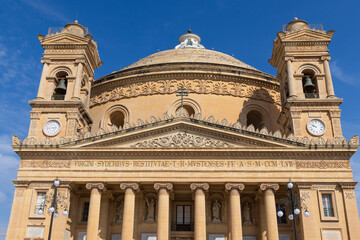 Malta, Mosta. Facade of the Sanctuary Basilica of the Assumption of Our Lady or Rotunda of Mosta. Dome, bell towers, pediment, Ionic columns. Third-largest unsupported dome in the world.