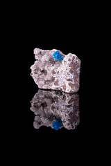 blue Pentagonite and Cavansite mixed on white Stilbite. Specimen from Wagholi Quarry, Pune, Maharashtra, India. Photography isolated on black background