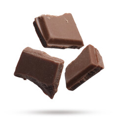 Pieces of sweet chocolate falling on white background