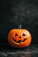 Smiling carved pumpkin on a dark background for Halloween celebration
