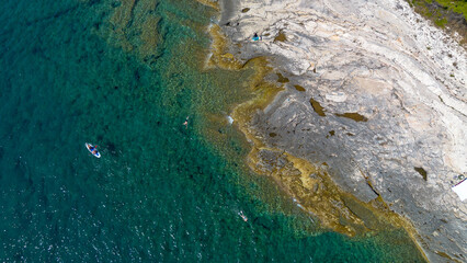 Aerial view of the rocky coast and crystal clear waters, Losinj Island, Croatia