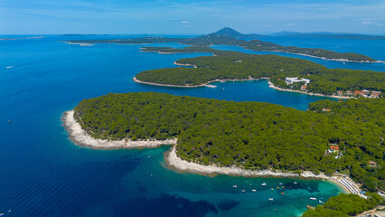 Aerial view of the rocky coast and crystal clear waters on a clear day, Losinj Island, Croatia