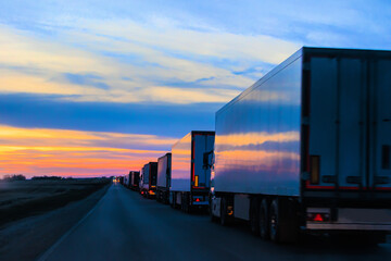 Obraz premium Many Trucks on the Country Road