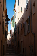 Walking in Saint-Tropez famous touristic village on French Riviera, summer vacation, colorful houses, Var, Provence, France
