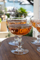 Summer party, French brut rose champagne sparkling wine in coupe glasses in yacht harbour of Port Grimaud near Saint-Tropez, French Riviera vacation, Var, France