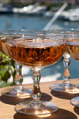 Summer party, French brut rose champagne sparkling wine in coupe glasses in yacht harbour of Port Grimaud near Saint-Tropez, French Riviera vacation, Var, France