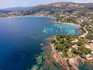 Panoramic view from above on blue Mediterranean dea, sandy beach of Agay town, summer vacation destination near Esterel mountains, French Riviera, Provence. France