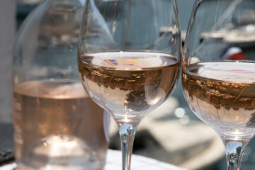 Glasses of cold rose gris Cote de Provence wine in yacht harbour of Port Grimaud, summer vacation on French Riviera in Provence, France