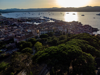 Obraz premium Aerial view on bay, hills,, old citadel fort, olorful houses of famous Saint-Tropez town on French Riviera, Var, Provence, France, summer vacation destination