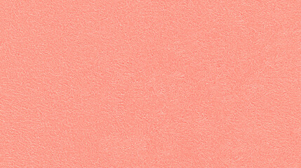 a seamless texture of slightly textured colored paper in pastel coral color