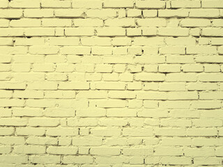 Fototapeta premium Brick bright yellow wall background or texture.