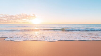 Obraz premium Sandy Beach at Sunset with Gentle Waves and Golden Light