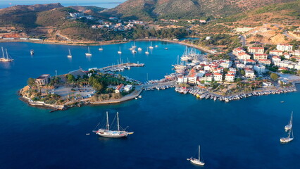 Stunning aerial view of Datça, Turkey. Amphitheater Peninsula separates Holiday village to two main beaches. Tranquil waters and anchored yachts enhance the idyllic scene © Faraways