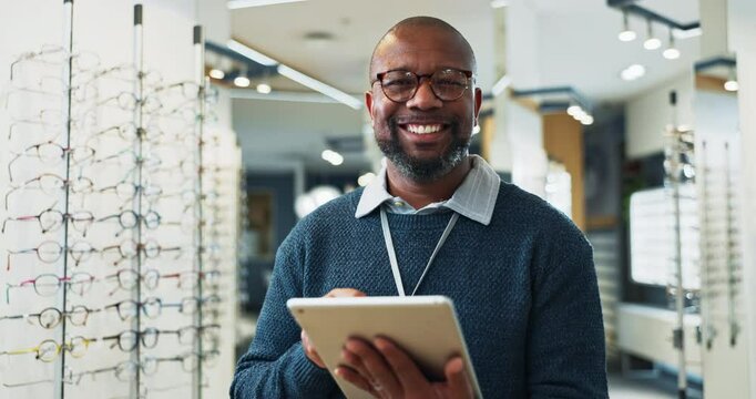 Optometry, glasses or black man with tablet for portrait, product information or inventory management in store. Sales person, tech or face at stock for eye care, check or typing for website update