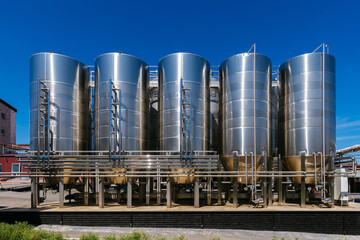 Modern winery production line. Large tanks for fermentation