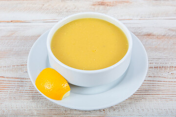 Turkish cuisine Lentil soup, melted butter and red pepper sauce. Served with bread and lemon. Local name; suzme mercimek corbasi.