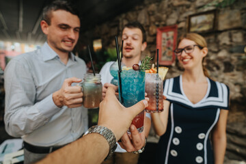 A group of friends cheerfully toasting with vibrant cocktails during an outdoor social event. The atmosphere is joyful and relaxed, perfect for celebrating togetherness.