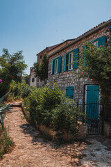 A small alley and a cozy street with flowers and cactus Vrsar Croatia 08.07.24