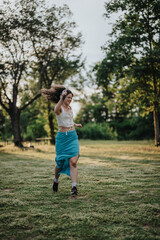 A woman joyfully performs a modern dance in a sunlit park, capturing the essence of freedom,...