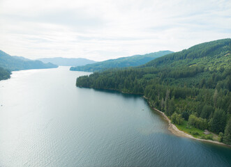 A beautiful lake with a forest in the background