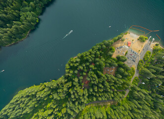A beautiful view of a lake with a forest in the background