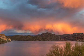 Orange cloud explosion over lake