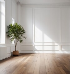 An empty white room with a wooden floor and a potted plant