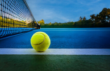 Tennis ball is on the line. Early evening background.