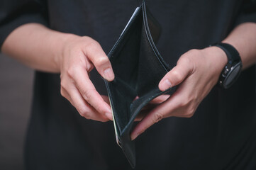 Hands holding empty wallet, wallet broke, Empty money in wallet, concept money deficit, money is...