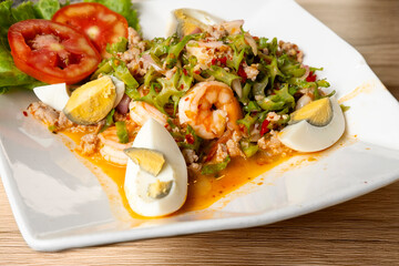 Winged bean salad on a wooden table