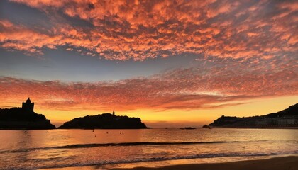  Sunset over the ocean painting the sky with hues of gold and orange