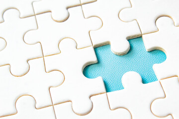 Fototapeta premium close-up of a missing jigsaw puzzle piece